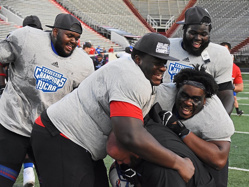 The Hutchinson Community College Blue Dragons celebrate winning the National Junior College Athletic Association Championship against Snow College on Saturday, June 5, 2021 at War Memorial Stadium in Little Rock. See more photos at arkansasonline.com/66njcaa/..(Arkansas Democrat-Gazette/Staci Vandagriff)