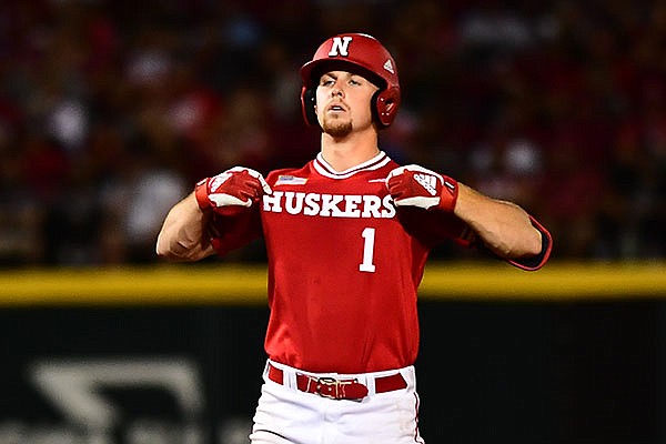 Nebraska's Spencer Schwellenbach celebrates after hitting a game-tying single during an NCAA regional game against Arkansas on Sunday, June 6, 2021, in Fayetteville.