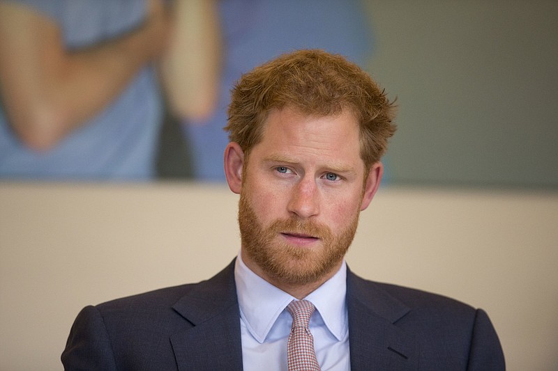 FILE - In this Thursday July 7, 2016 file photo, Britain's Prince Harry takes part in a round table discussion with HIV doctors at King's College Hospital in south London as part of his desire to learn more and raise public awareness in the fight against HIV and AIDS both internationally and in the UK. (AP Photo/Matt Dunham, Pool, File)