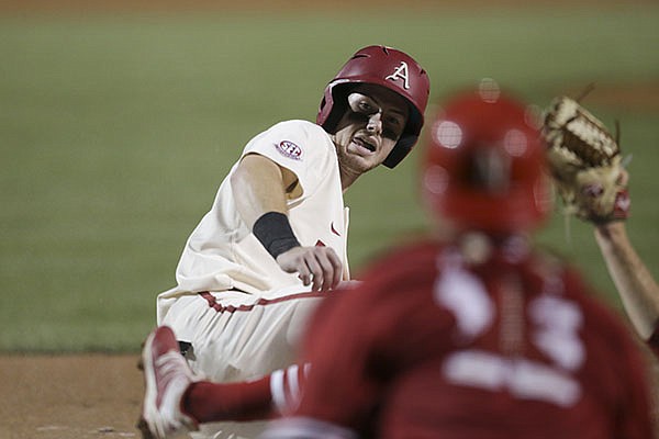 Arkansas' Matt Goodheart slides into home plate during an NCAA regional game against Nebraska on Sunday, June 6, 2021, in Fayetteville. Arkansas' Matt Goodheart slides into home plate during an NCAA regional game against Nebraska on Sunday, June 6, 2021, in Fayetteville.