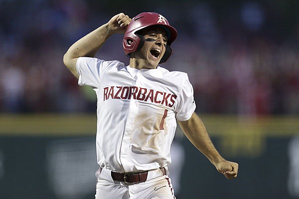 Arkansas second baseman Robert Moore celebrates as he runs toward home plate during the eighth inning of an NCAA regional game against Nebraska on Monday, June 7, 2021, in Fayetteville. Arkansas second baseman Robert Moore celebrates as he runs toward home plate during the eighth inning of an NCAA regional game against Nebraska on Monday, June 7, 2021, in Fayetteville.