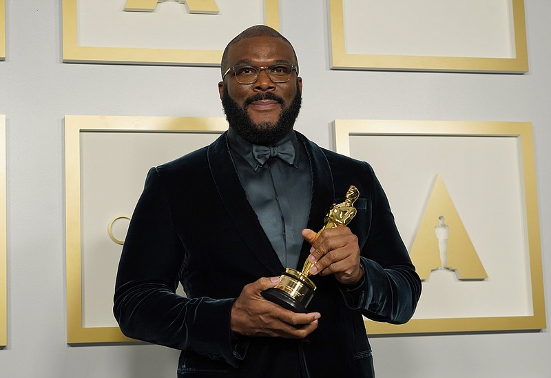 Tyler Perry, winner of the Jean Hersholt Humanitarian Award, poses in the press room at the Oscars on Sunday, April 25, 2021, at Union Station in Los Angeles. (AP Photo/Chris Pizzello, Pool)