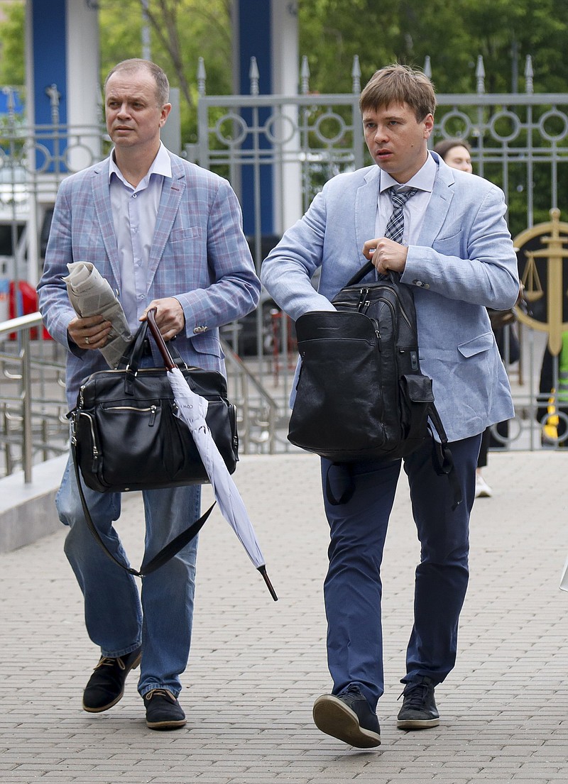 Russian lawyers Ivan Pavlov (left) and Yevgeny Smirnov walk to a court session Wednesday in Moscow.
(AP/Alexander Zemlianichenko)