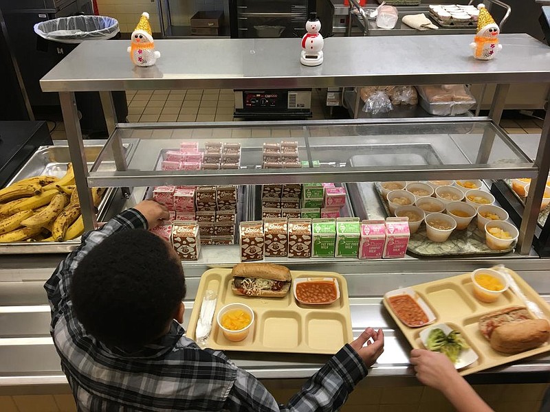 Elementary school students fill their lunch trays in this Jan. 25, 2017, file photo. (AP/Mary Esch)