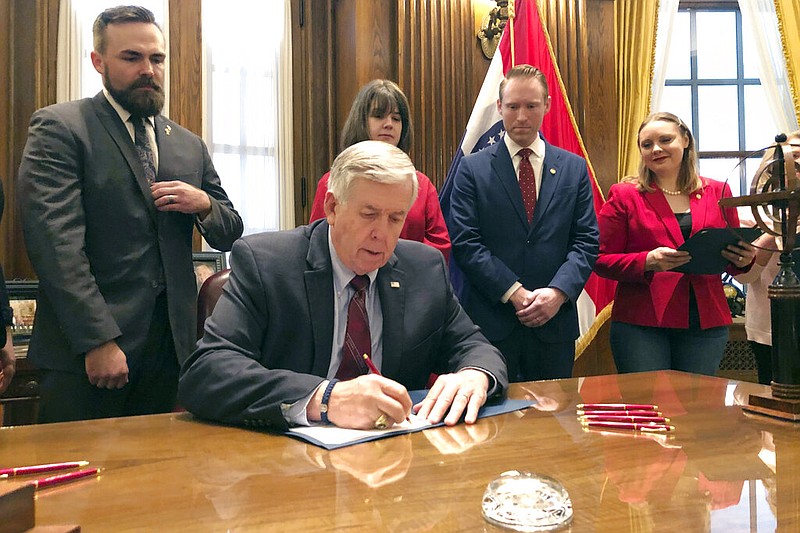 Missouri Gov. Mike Parson signs one of the nation's most restrictive abortion bills, banning the procedure on or beyond eight weeks of pregnancy, in Jefferson City, Mo., in this May 24, 2019, file photo. (AP/Summer Balentine)