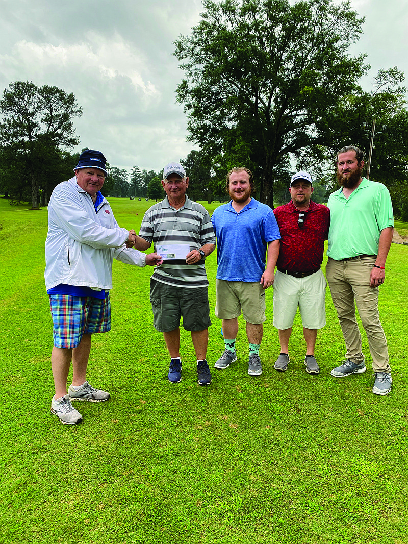 Tournament Champs
Camden Kiwanis Club member Jim Dick Coleman presents the first place prize to Team Campbell & Company. Pictured from left is Coleman, Eddie Folse Jr., Jacob Wright, Clint Wright and Zach Russell.