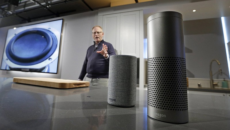 David Limp, senior vice president of Devices and Services at Amazon, displays a new Echo (left) and an Echo Plus during an event announcing several new Amazon products by the company. On Tuesday, Amazon started a program that forces users of many Echo smart speakers and Ring security cameras to automatically share a small portion of their wireless bandwidth with neighbors.
(AP)