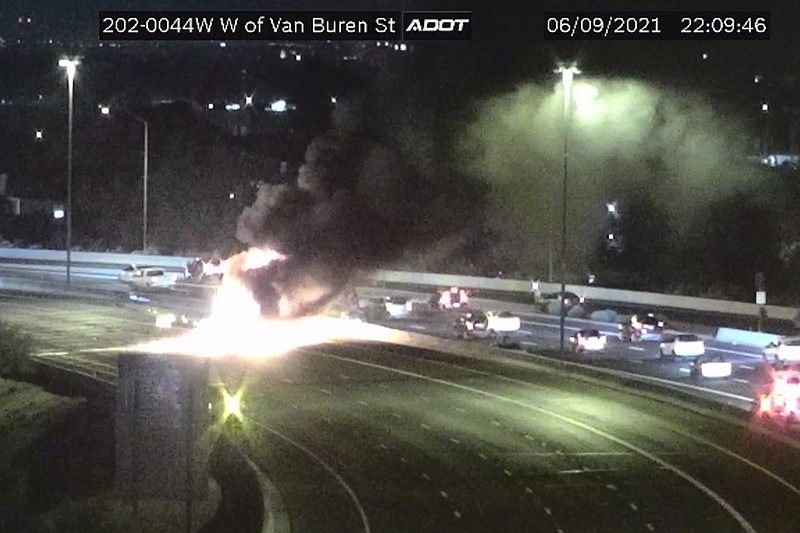 This image from an Arizona Department of Transportation remote traffic camera shows the scene of a crash Wednesday involving a milk tanker truck in Phoenix.
(AP/Arizona Department of Transportation)