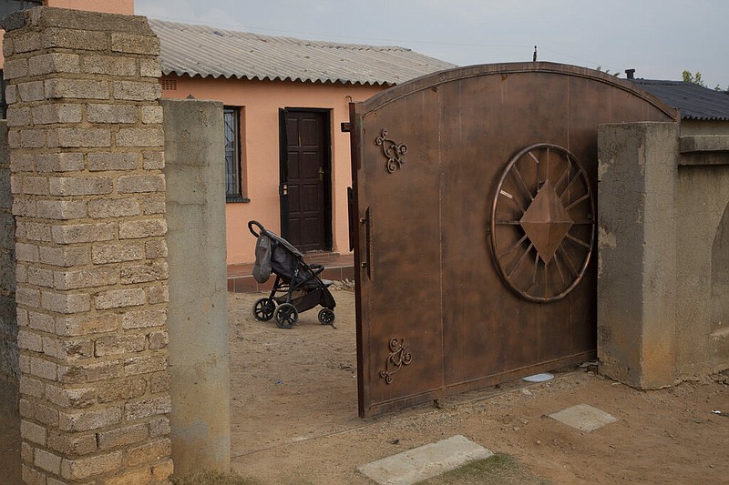 A baby carriage is seen outside the home of Gosiame Thamara Sithole in Tembisa, near Johannesburg, South Africa, on Thursday, June 10, 2021. The South African government is trying to verify a claim that Sithole has given birth to 10 babies in what would be the world's first case of decuplets. (AP/Denis Farrell)