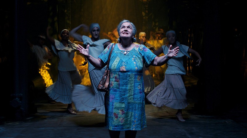 Winner, Winner: Abuela Claudia (Olga Merediz) reminisces about her impoverished Cuban childhood and an imminent change of fortune in “In the Heights.”