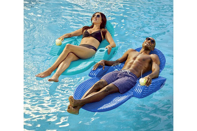 This image provided by Frontgate shows floating mats. "Frontgate's got a full-size reclinable pool chaise kitted out with drink holders." (Frontgate via AP)