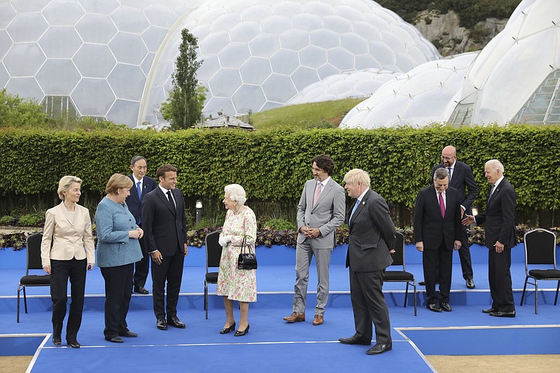 Britain’s Queen Elizabeth II (center) talks with G-7 leaders before a reception Friday at the Eden Project in Cornwall, England. Video at arkansasonline.com/612queen/.
(AP/Jack Hill)