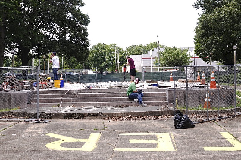 Workers dig up the remains of Confederate Gen. Nathan Bedford Forrest and his wife to move the bodies from Health Sciences Park in Memphis on June 4, 2021. The park used to bear the name of the early Ku Klux Klan leader and feature a statue of the cavalryman on a horse, but the name has been changed and the statue removed in recent years. (AP/Karen Pulfer Focht)