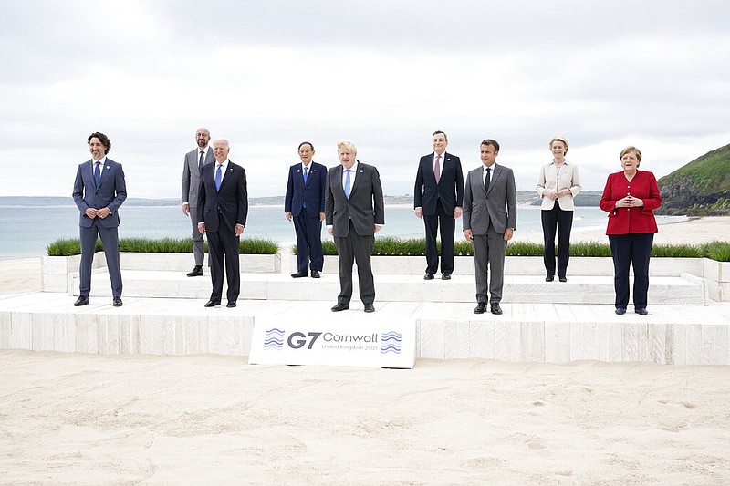 Leaders of the G7 pose for a group photo on overlooking the beach at the Carbis Bay Hotel in Carbis Bay, St. Ives, Cornwall, England, Friday, June 11, 2021. (AP/Patrick Semansky, Pool)