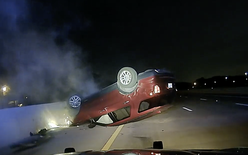 Janice Nicole Harper suffered "severe bodily injuries" in a July 9, 2020 crash that caused her vehicle to flip upside-down, according to a lawsuit filed last month in Pulaski County Circuit Court. This screenshot from Arkansas State Police dash cam video shows the wreck.