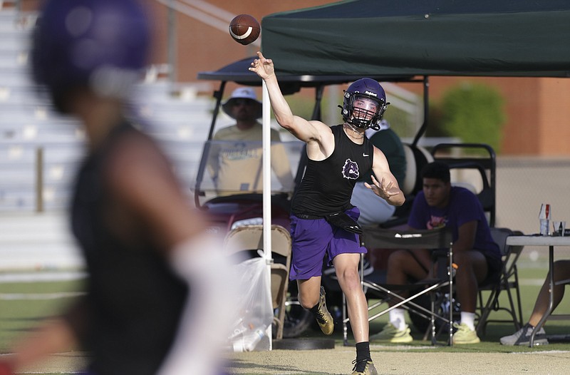 Fayetteville quarterback Bladen Fike throws, Friday, June 11, 2021 during the 7on7 Football Tournament at Airedale Stadium in Alma. Check out nwaonline.com/210612Daily/ for today's photo gallery. ...(NWA Democrat-Gazette/Charlie Kaijo)