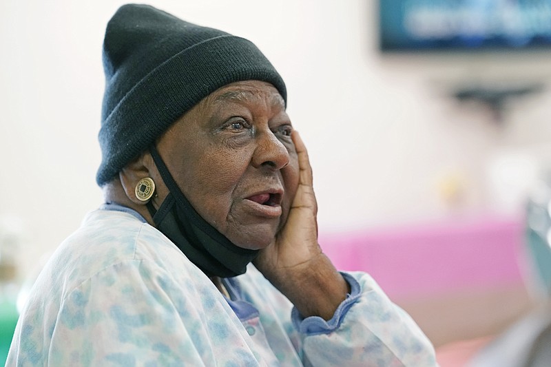 P.M. Browner, 88, speaks about her apprehension over receiving the COVID-19 vaccine, while waiting for a transportation bus at the Rev. S.L.A. Jones Activity Center for the Elderly to take her and other seniors to the Aaron E. Henry Community Health Service Center to receive a vaccination, in Clarksdale, Miss., in this April 7, 2021, file photo. New COVID-19 cases are declining across the most of the country, even in some states with vaccine-hesitant populations. But almost all states bucking that trend have lower-than-average vaccination rates, and experts warn that relief from the pandemic could be fleeting in regions where few people get inoculated.  (AP Photo/Rogelio V. Solis, File)