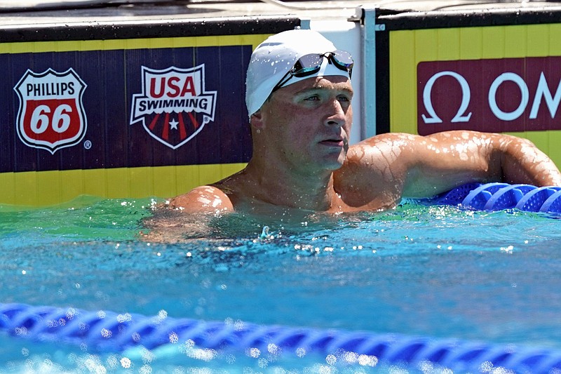 FILE- In this July 31, 2019, file photo, Ryan Lochte looks on after competing in the men's 200-meter individual medley time trial at the U.S. national swimming championships in Stanford, Calif. (AP Photo/David J. Phillip, File)