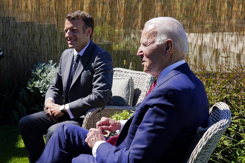 President Joe Biden and French President Emmanuel Macron visit at the G-7 summit in Carbis Bay, England, on Saturday, June 12, 2021. (AP/Patrick Semansky)
