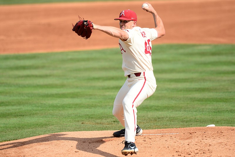 Arkansas pitcher Kevin Kopps throws during an NCAA super regional game against North Carolina State on Sunday, June 13, 2021, in Fayetteville.