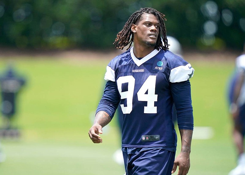 In this photo made on Tuesday, June 8, Dallas Cowboys defensive end Randy Gregory (94) walks the field during an NFL football team practice in Frisco, Texas. Gregory isn’t ashamed of a suspension-filled past that nearly derailed his NFL career, just maybe a little tired of it being the focus of his story. (AP Photo/LM Otero)