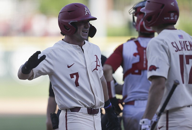 Arkansas infielder Brady Slavens (17) runs home for a score, Sunday, June 13, 2021 during the seventh inning in Game 3 of the Fayetteville Super Regional at Baum-Walker Stadium in Fayetteville. Check out nwaonline.com/210614Daily/ for today's photo gallery. .(NWA Democrat-Gazette/Charlie Kaijo)