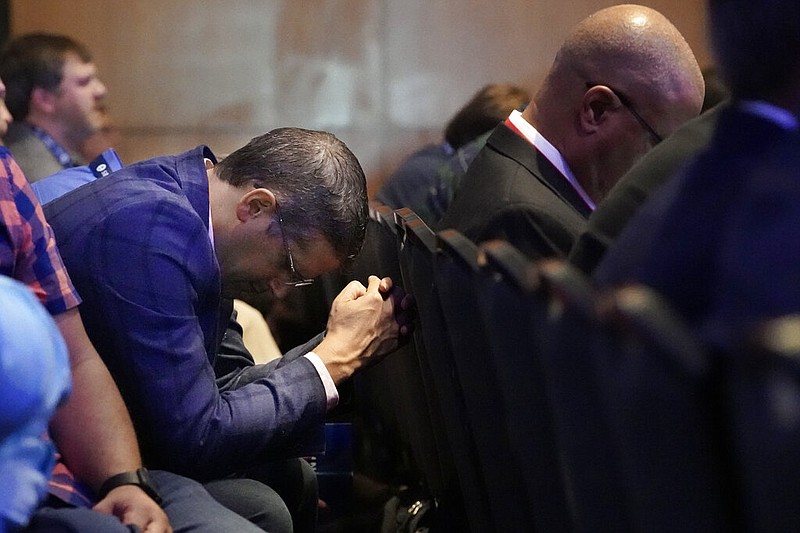 A man prays during the executive committee plenary meeting at the Southern Baptist Convention's annual meeting Monday, June 14, 2021, in Nashville, Tenn. (AP/Mark Humphrey)