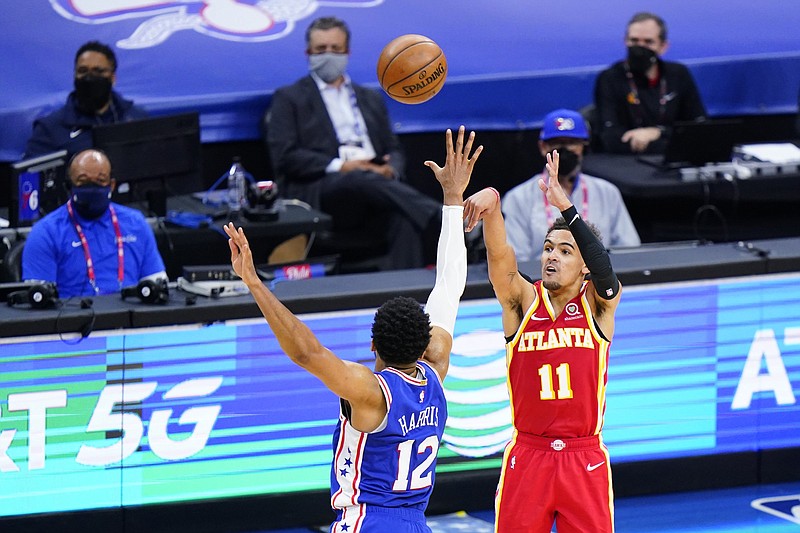 Trae Young (11) of the Atlanta Hawks shoots over Tobias Harris of the Philadelphia 76ers on Wednesday night in Game 5 of their NBA Eastern Conference semifinal series. Young finished with 39 as the Hawks won to take a 3-2 lead in the series.
(AP/Matt Slocum)