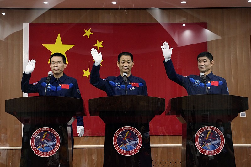 “The task is very arduous, and there are many challenges,” said Chinese mission commander Nie Haisheng, flanked by Tang Hongbo (left) and Liu Boming on Wednesday ahead of today’s launch.
(AP/Ng Han Guan)