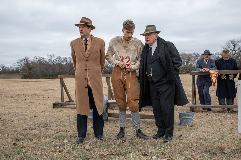 Coach and educator Rusty Russell (Luke Wilson), Snoggs (Jacob Lofland) and Doc Hall (Martin Sheen) help a ragtag group of underdogs to a Texas high school football championship in “12 Mighty Orphans.”