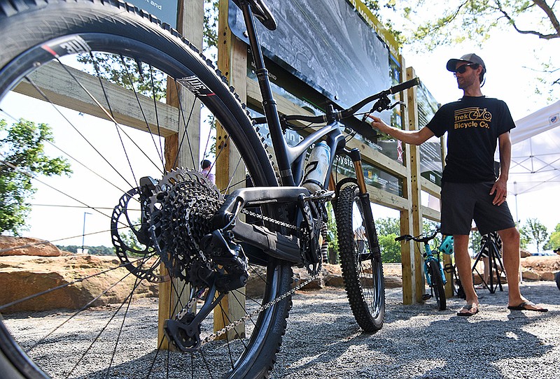 Mitchell Allen of Little Rock checks out the map of the new bike trail system at River Mountain Park during Little Rock’s and the Arkansas Parks and Recreation Foundation’s dedication of the system Thursday.
(Arkansas Democrat-Gazette/Staci Vandagriff)