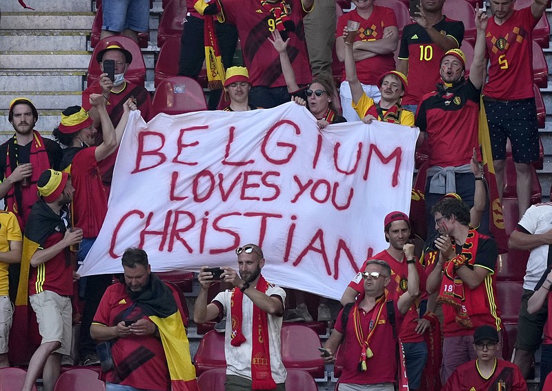 Belgian fans hold a banner supporting Denmark’s Christian Eriksen before Thursday’s Euro 2020 group B match at Parken Stadium in Copenhagen. Eriksen is recovering after suffering cardiac arrest during Denmark’s game against Finland on Saturday at the European Championship and will be fitted with a device to monitor his heart rhythm.
(AP/Martin Meissner)