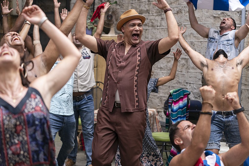 Kevin Rosario (Jimmy Smits) leads the crowd with his impromptu dance in “In the Heights,” which couldn’t topple still No. 1 “A Quiet Place Part II.”
(Warner Bros. Pictures)