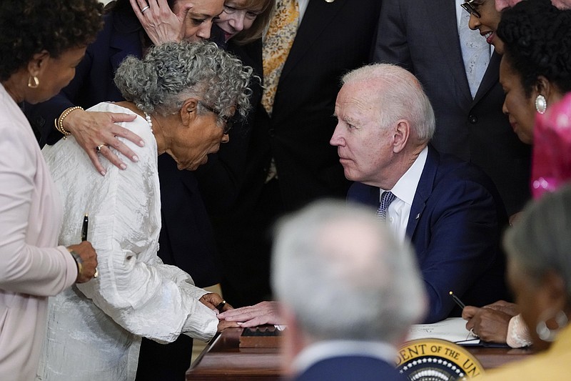 President Joe Biden speaks Thursday with Opal Lee of Texas, who campaigned for passage of the Juneteenth National Independence Day Act, which Biden signed in the East Room of the White House.
(AP/Evan Vucci)