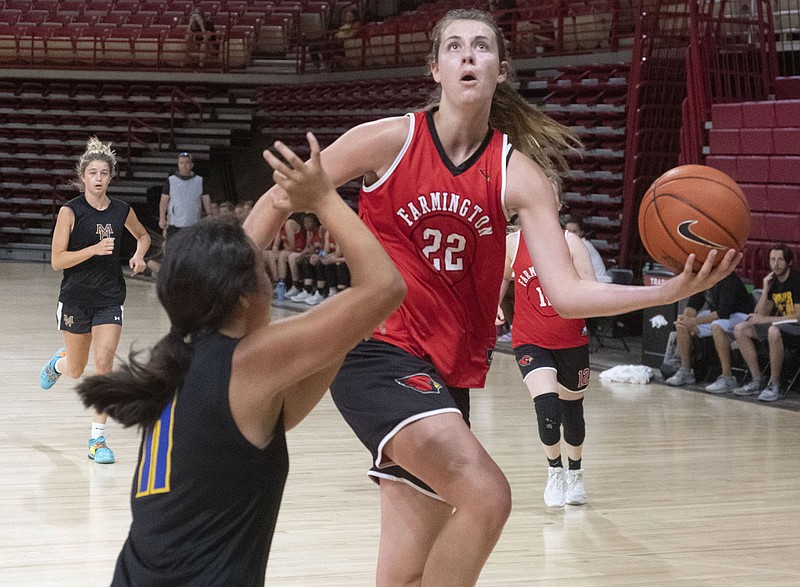 Farmington's Jenna Lawrence takes the ball to the hoop Wednesday June 16, 2021 during a team camp at the University of Arkansas in Fayetteville. Lawrence, a UA women's basketball commit, moved recently from Melbourne to Farmington.
(NWA Democrat-Gazette/J.T. Wampler)