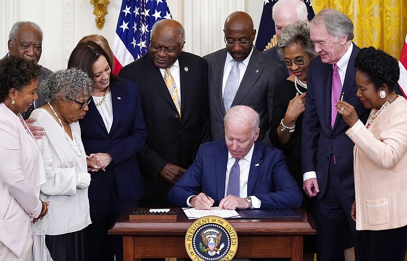 President Joe Biden signs the Juneteenth National Independence Day Act in the East Room of the White House on Thursday, June 17, 2021. (AP/Evan Vucci)