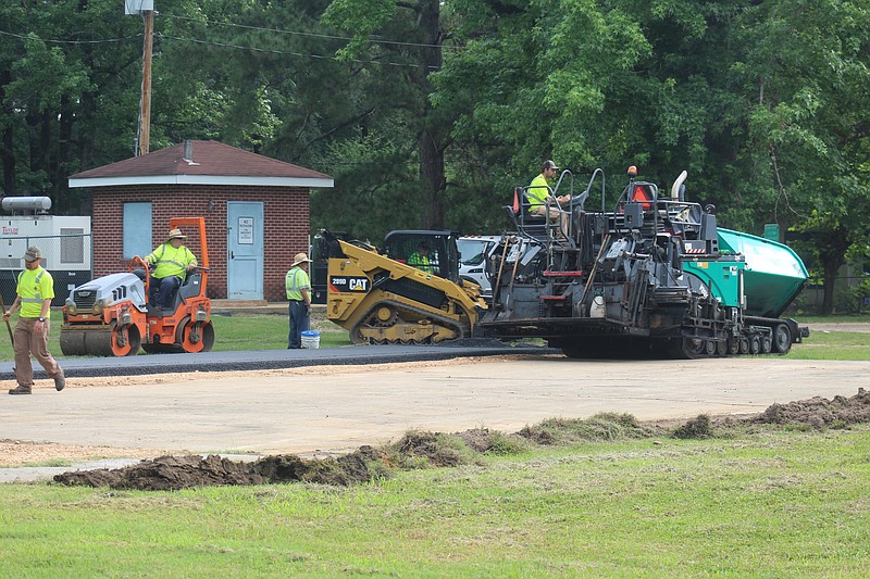 Smackover Paving’s work on the MLK Park basketball court was held up until Thursday due to continuous rainy weather. A ribbon cutting will be held at the park Friday, June 18 at 12:30 to celebrate the renovations. (Matt Hutcheson/News-Times)