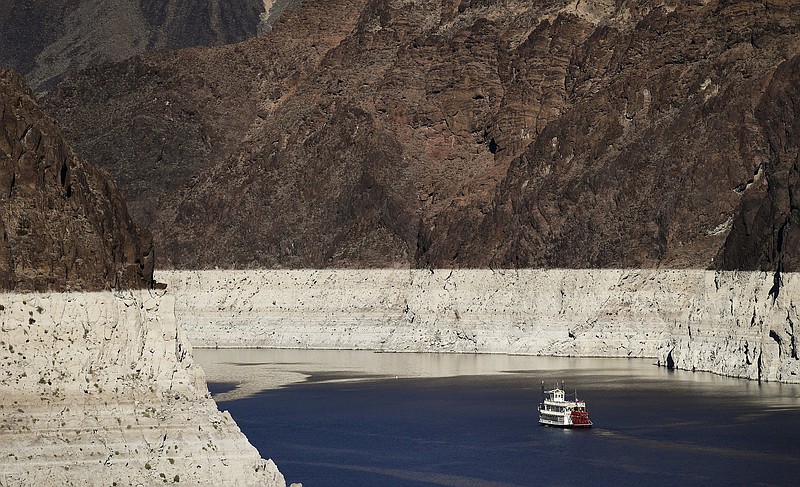 A boat glides through Lake Mead at Hoover Dam near Boulder City, Nev., in a file photo. Despite drought, cities in the U.S. West expect their populations to grow considerably in the coming decades.
(AP)