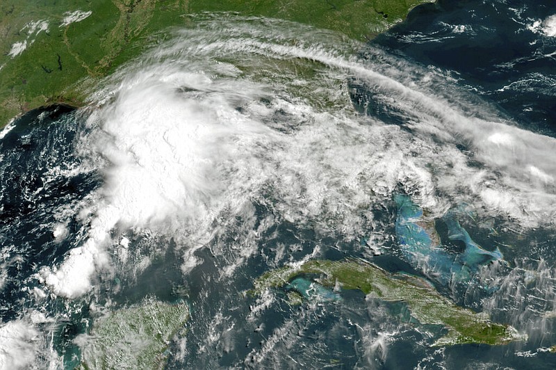 This GOES-16 GeoColor satellite image taken at 10 a.m. Friday, June 18, 2021, and provided by NOAA, shows a tropical weather system in the Gulf of Mexico. (NOAA via AP)