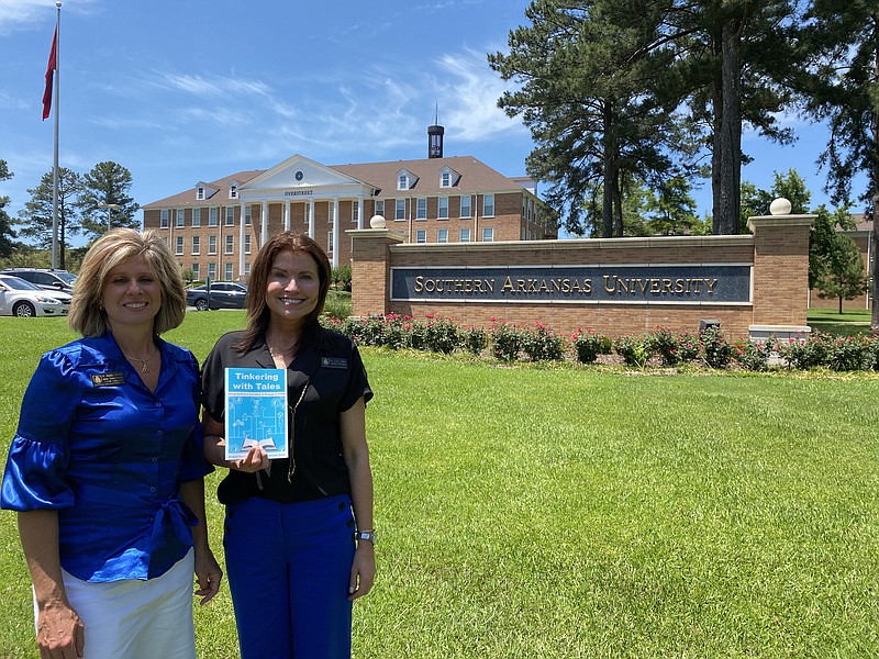 Dr. Angela Stanford and Dr. Lisa Oden hold their book, Tinkering with Tales: Using Children’s Literature to Engage in STEM, in front of Overstreet on the SAU campus. Not pictured is co-author Dr. Julie Quast.