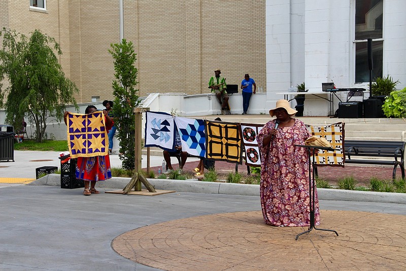The Reed family presents the “Story of the Quilts” during Pine Bluff’s downtown Juneteenth celebration Saturday. 
(Pine Bluff Commercial/Eplunus Colvin)