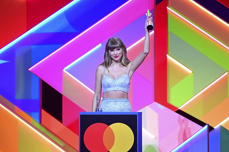 Taylor Swift accepts the Global Icon award during the Brit Awards 2021 at the O2 Arena, in London, Tuesday, May 11, 2021. (Ian West/PA via AP)