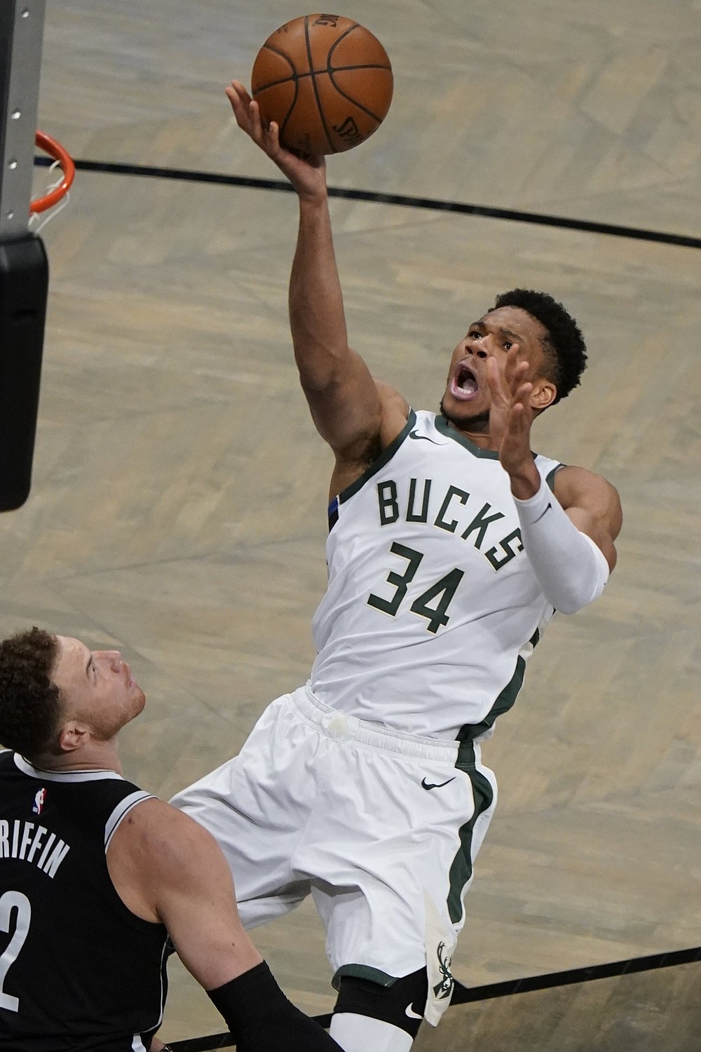 Milwaukee’s Giannis Antetokounmpo shoots over Brooklyn’s Blake Griffin on Saturday during the Bucks’ 115-111 overtime victory over the Nets in Game 7 of their NBA Eastern Conference semifinal in Brooklyn.
(AP/Frank Franklin II)