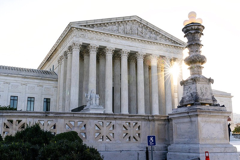 The sun rises behind the U.S. Supreme Court in Washington in this Nov. 10, 2020, file photo. (AP/Alex Brandon)