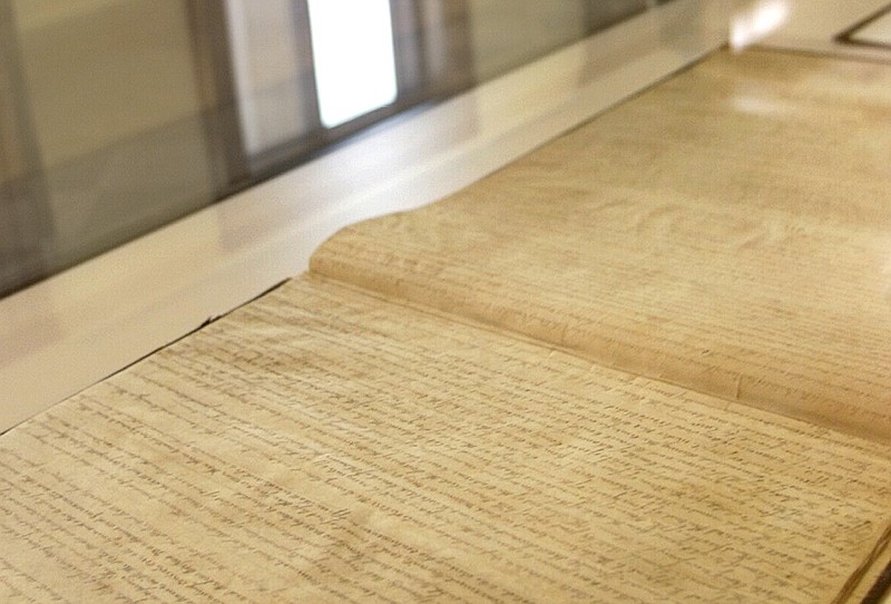 The original copy of the Arkansas Constitution, penned in 1836, is displayed under glass in the Justice Building in Little Rock in this April 27, 2001, file photo. (AP/Danny Johnston)