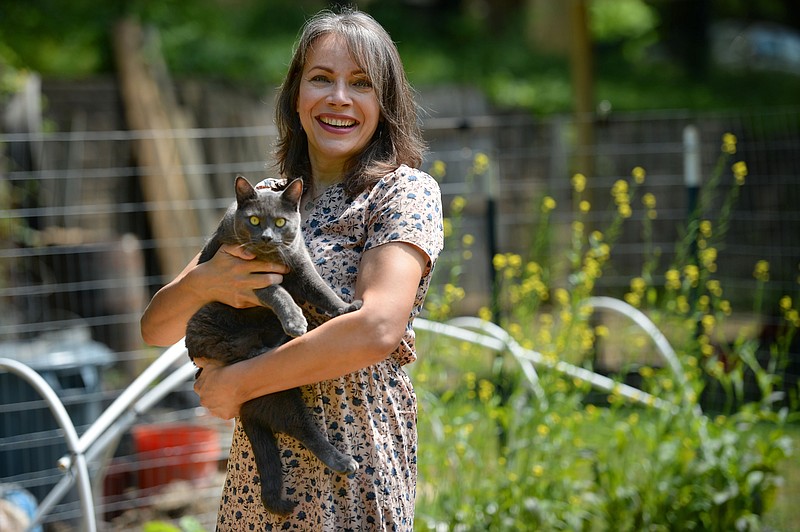 Evelyn Rios Stafford poses Wednesday, June 16, 2021, in her garden at her home in Fayetteville. Rios Stafford is a Justice of the Peace for Washington County and the first transgender woman elected as a public official in Arkansas.Visit nwaonline.com/210620Daily/ for today's photo gallery.
(NWA Democrat-Gazette/Andy Shupe)