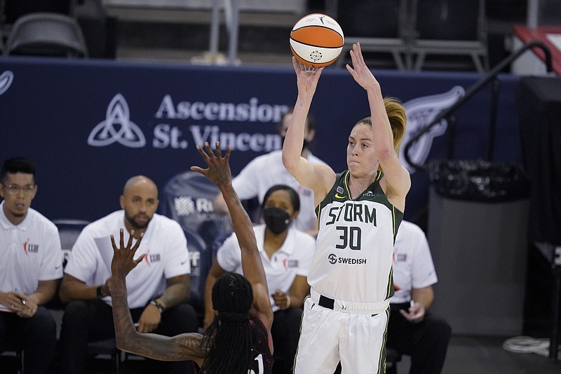 Seattle Storm’s Breanna Stewart shoots over Indiana Fever’s Jessica Breland during the second half of a WNBA basketball game Thursday, June 17, 2021, in Indianapolis. (AP Photo/Darron Cummings)