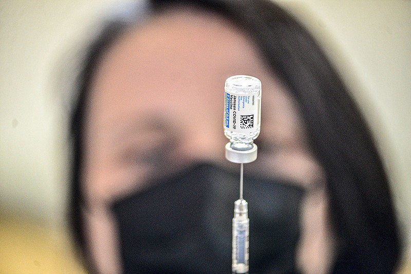 Neesha Kaeppel, a registered nurse at Brattleboro Memorial Hospital in Brattleboro, Vt., prepares a Johnson & Johnson covid-19 shot Wednesday at a vaccination clinic.
(AP/The Brattleboro Reformer/Kristopher Radder)