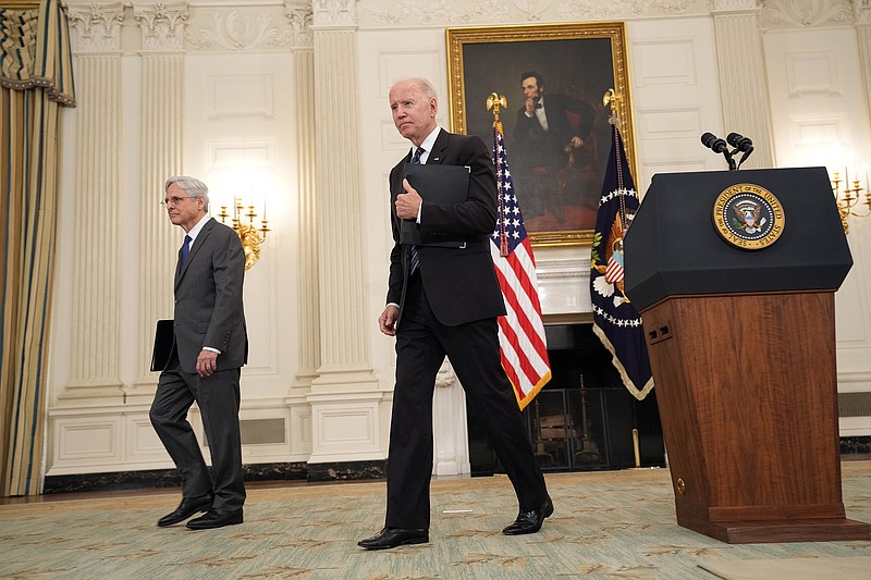 Attorney General Merrick Garland and President Joe Biden leave the state dining room at the White House on Wednesday after announcing new initiatives to deal with gun violence and crime.
(The New York Times/Doug Mills)