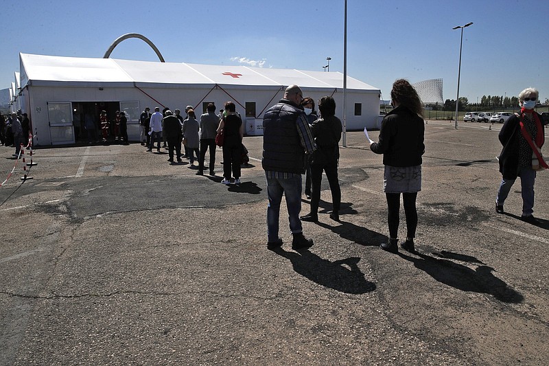 People wait in line in April to get a dose of Johnson & Johnson vaccine at a covid-19 vaccination center near Tor Vergata hospital in Rome. The virus has killed more than 127,000 people in Italy and damaged the European Union’s third-largest economy.
(AP/Alessandra Tarantino)